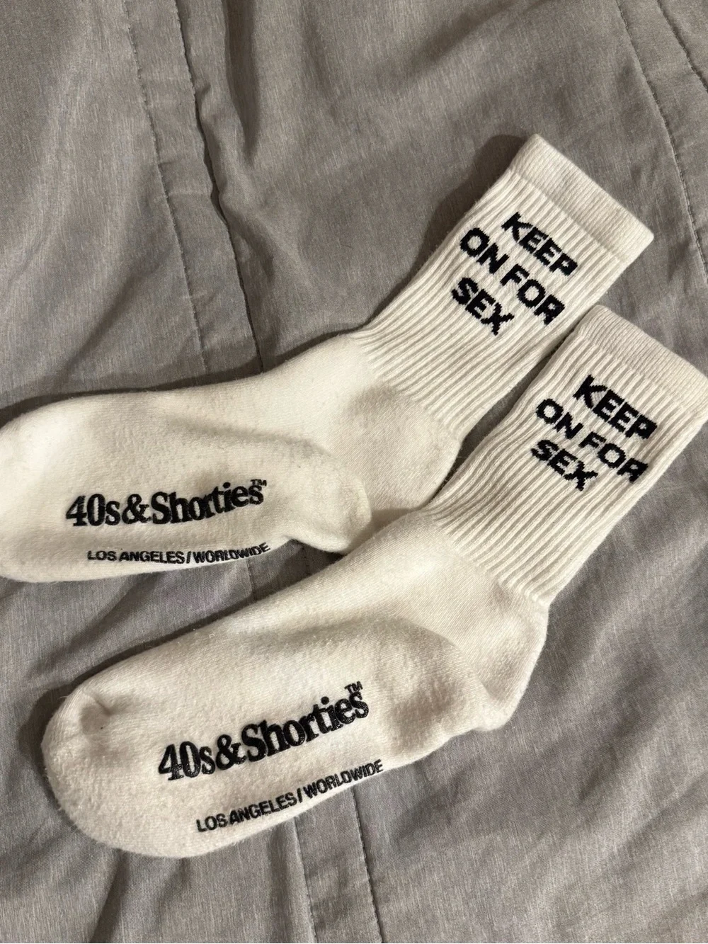 40s & Shorties white crew socks featuring a printed 